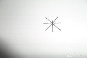 教小朋友用米字形画小花.